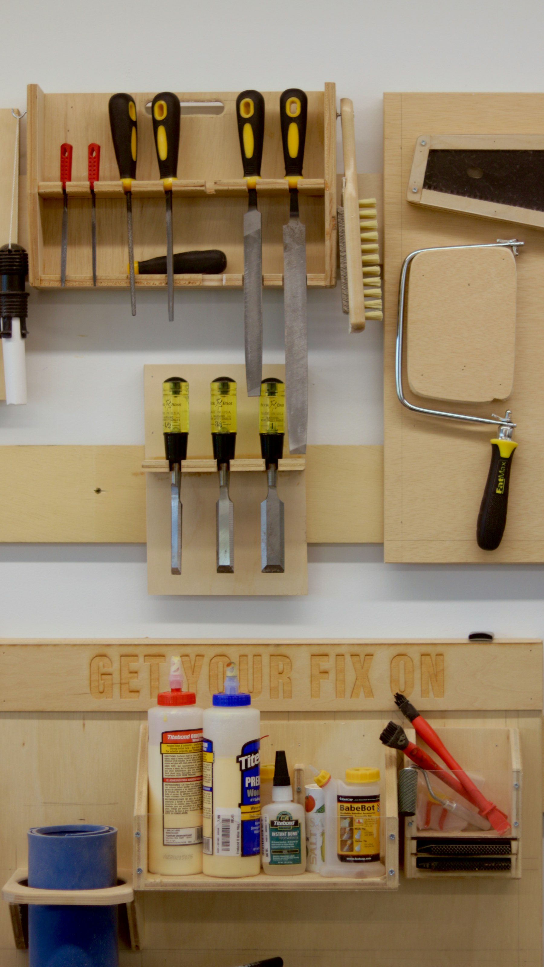 Workshop tools hanging above a workbench